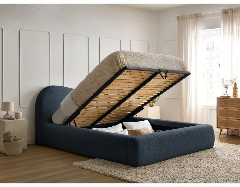 Тъмносиньо тапицирано двойно легло с място за съхранение с включена подматрачна рамка 140x190 cm Orlane – Bobochic Paris