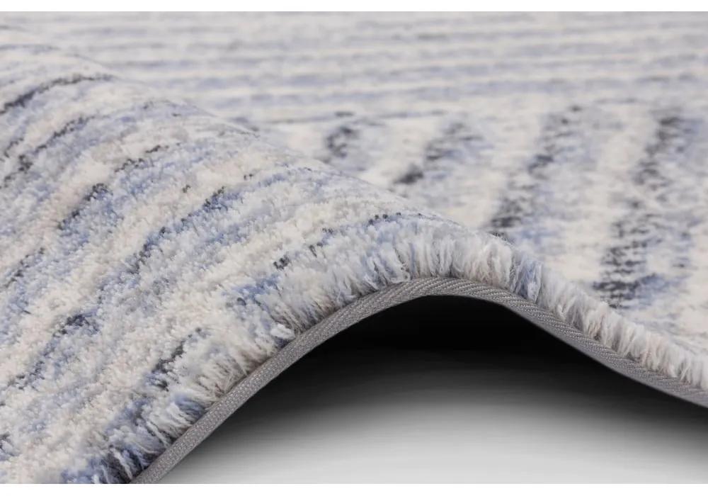 Светлосин вълнен килим 133x180 cm Strokes - Agnella