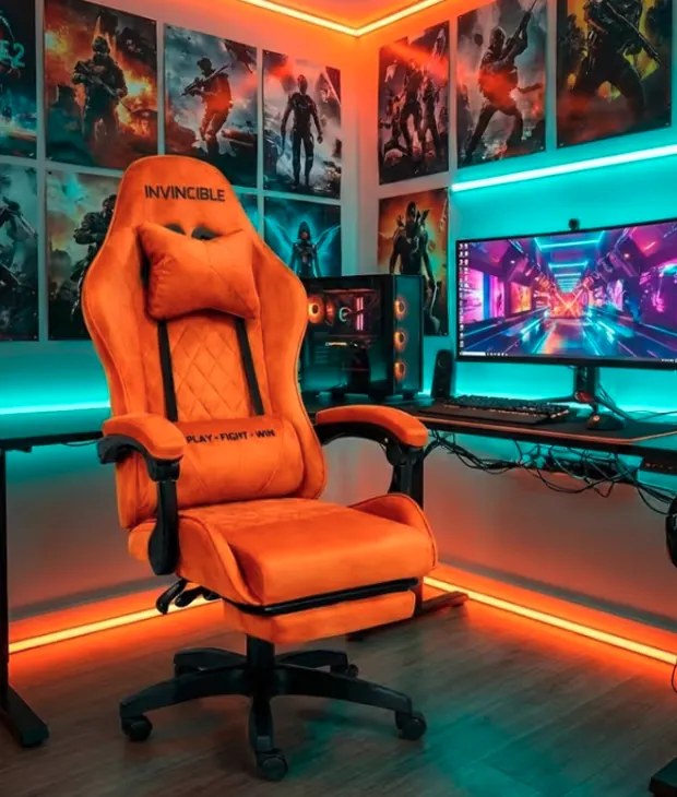 Оранжев геймърски стол с кадифена тапицерия и подвижна поставка за крака
