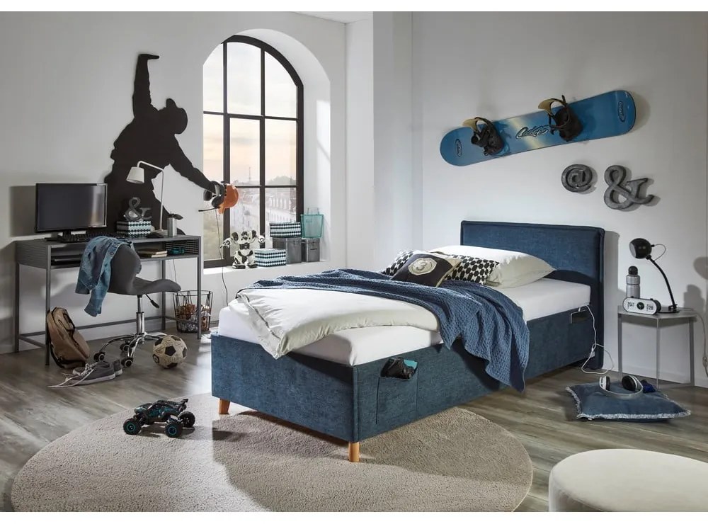 Тъмносиньо тапицирано детско легло 140x200 cm с място за съхранение с включена подматрачна рамка Fun – Meise Möbel
