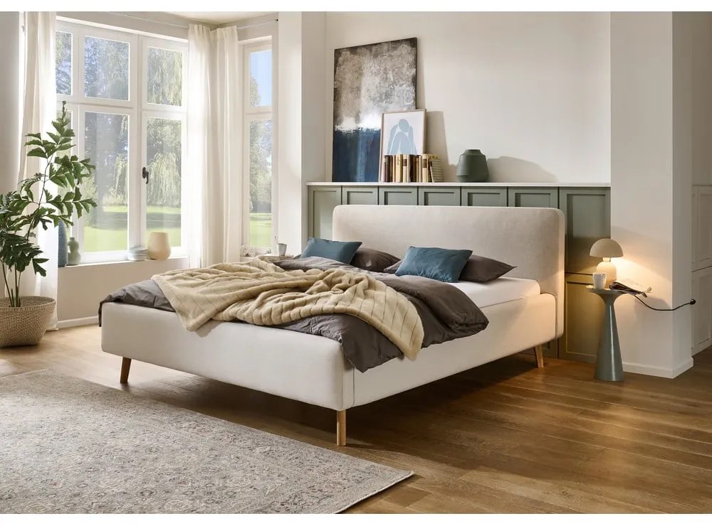 Кремаво тапицирано двойно легло с място за съхранение с включена подматрачна рамка 180x200 cm Mattis – Meise Möbel