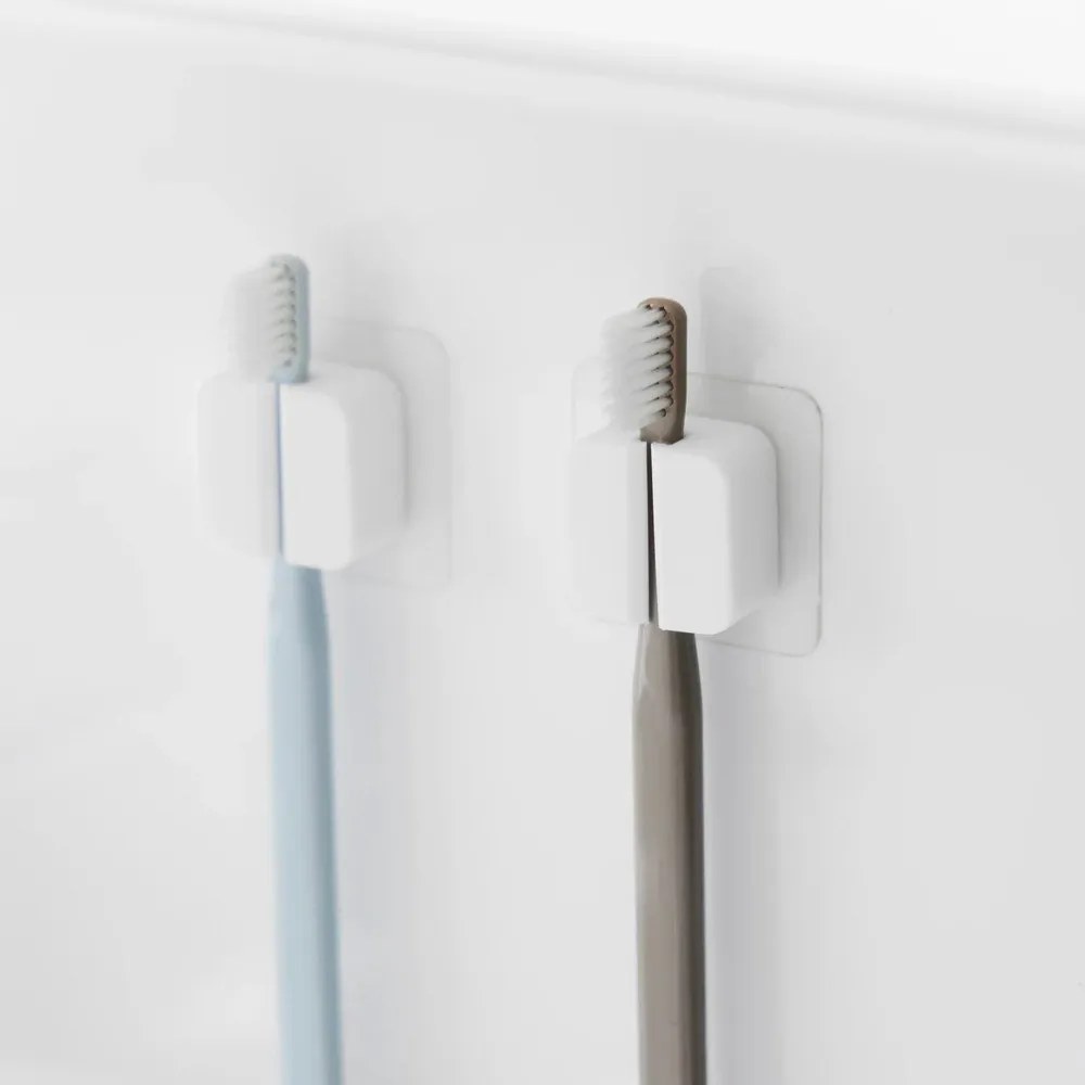 Бели силиконови мултифункционални държачи в комплект от 2 бр. Film Hook – YAMAZAKI