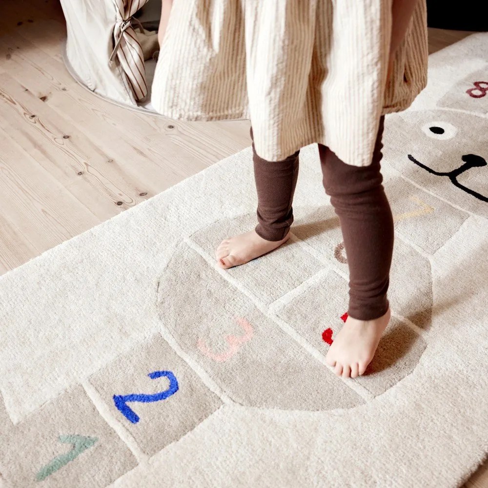 Ръчно изработено детско килимче за игра със смес от вълна 75x180 cm Rabbit Hopscotch – OYOY Mini