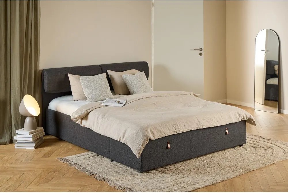 Тъмносиво двойно тапицирано легло с място за съхранение и включена подматрачна рамка 160x200 cm Calvi – Actona