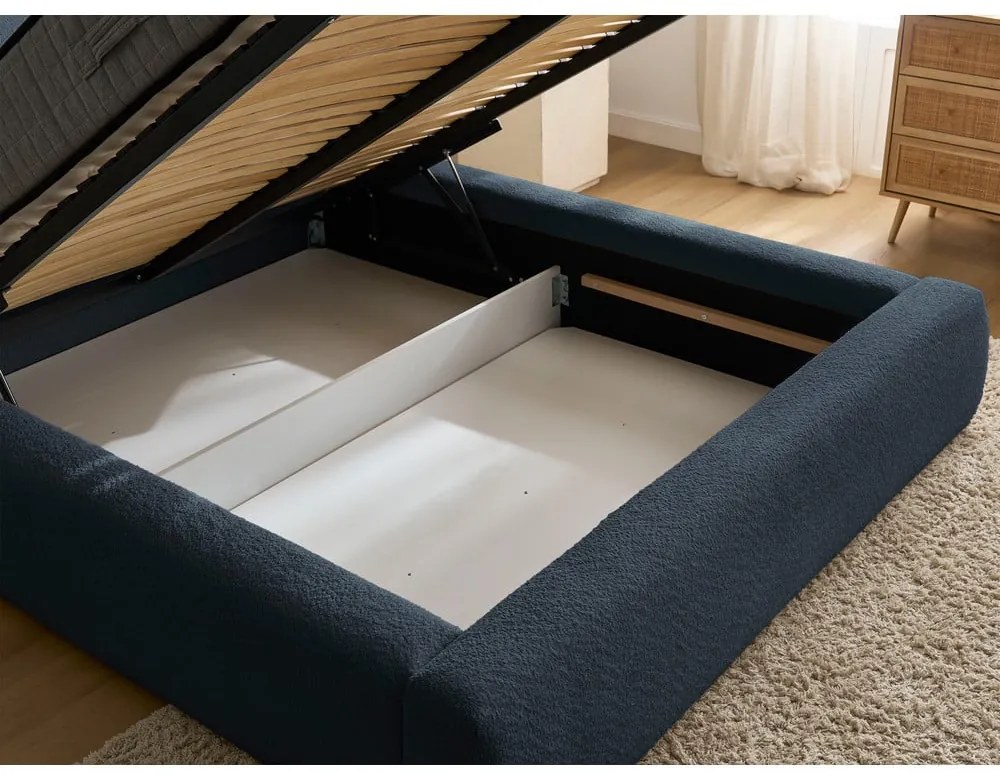 Тъмносиньо тапицирано двойно легло с място за съхранение с включена подматрачна рамка 180x200 cm Orlane – Bobochic Paris
