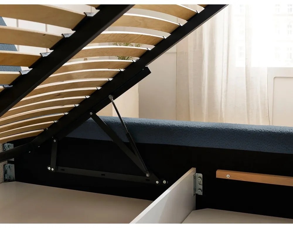 Тъмносиньо тапицирано двойно легло с място за съхранение с включена подматрачна рамка 160x200 cm Orlane – Bobochic Paris