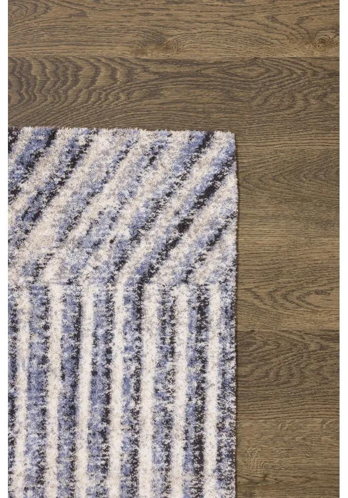 Светлосин вълнен килим 133x180 cm Strokes - Agnella
