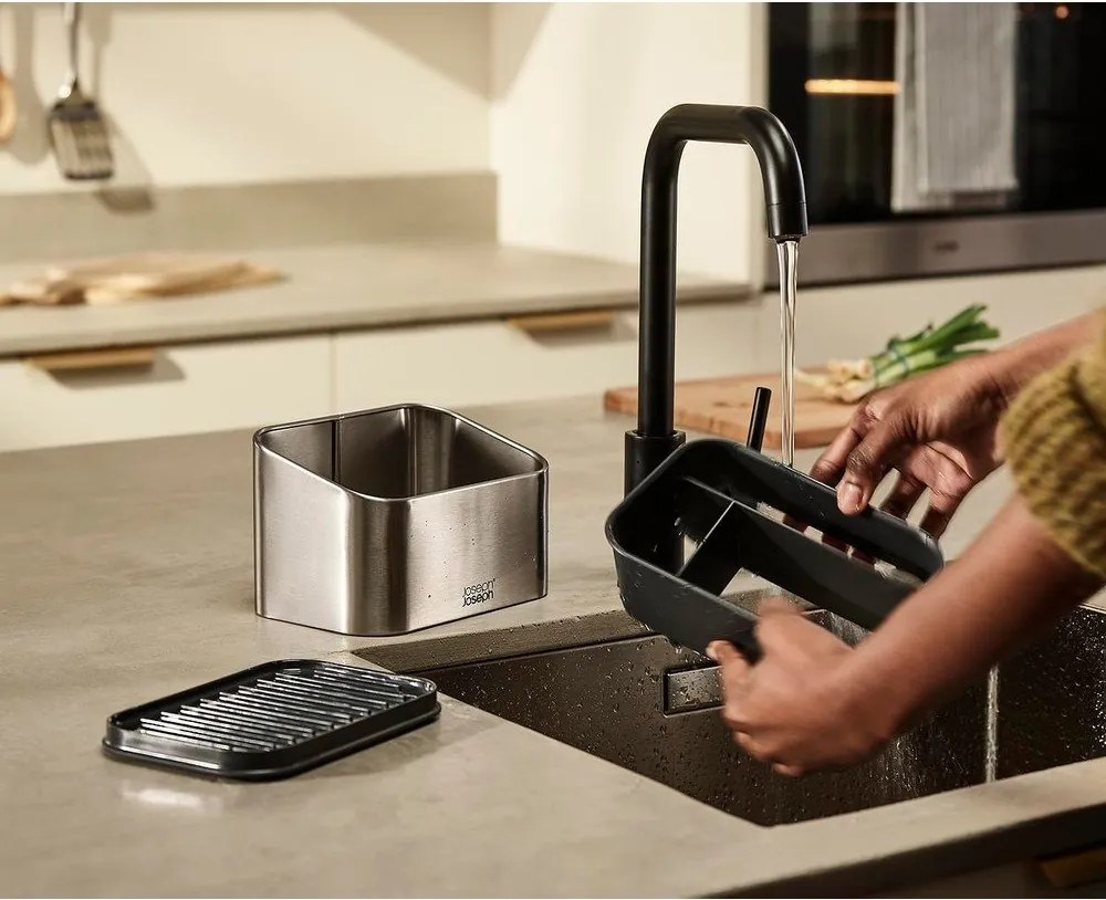 Метална стойка за перилни препарати в блестящо сребрист цвят Surface – Joseph Joseph