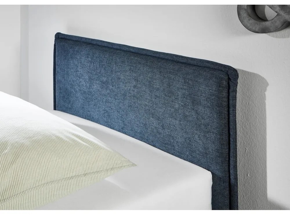 Тъмносиньо тапицирано детско легло 140x200 cm с място за съхранение с включена подматрачна рамка Fun – Meise Möbel