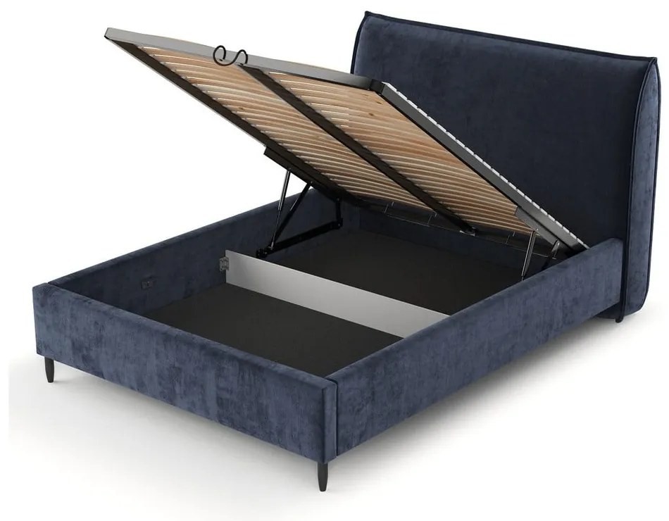 Тъмносиньо тапицирано двойно легло с място за съхранение с включена подматрачна рамка 180x200 cm Shell – Maison de Rêve