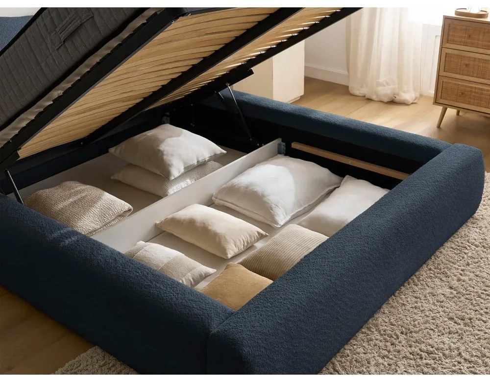 Тъмносиньо тапицирано двойно легло с място за съхранение с включена подматрачна рамка 180x200 cm Orlane – Bobochic Paris