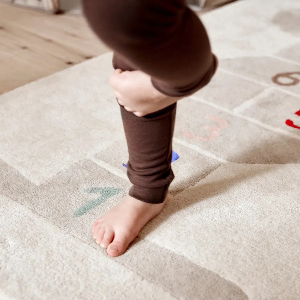 Ръчно изработено детско килимче за игра със смес от вълна 75x180 cm Rabbit Hopscotch – OYOY Mini