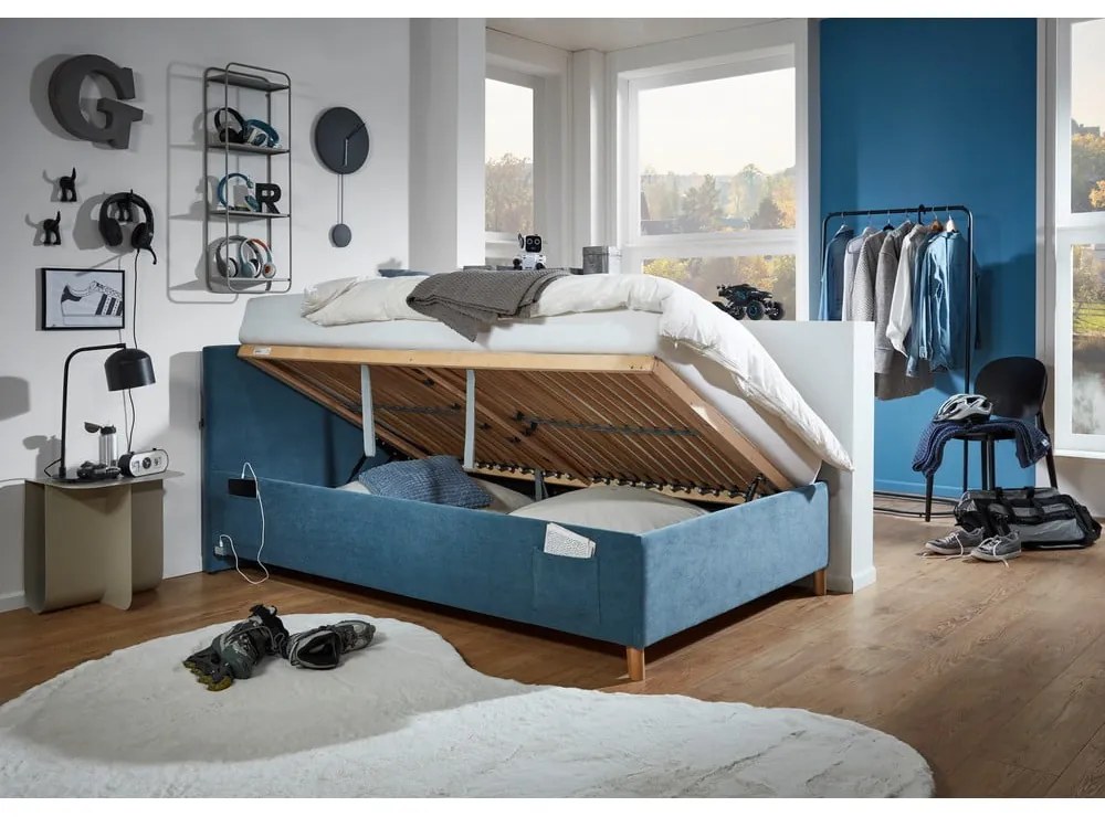 Синьо тапицирано детско легло 120x200 cm с място за съхранение с включена подматрачна рамка Cool – Meise Möbel