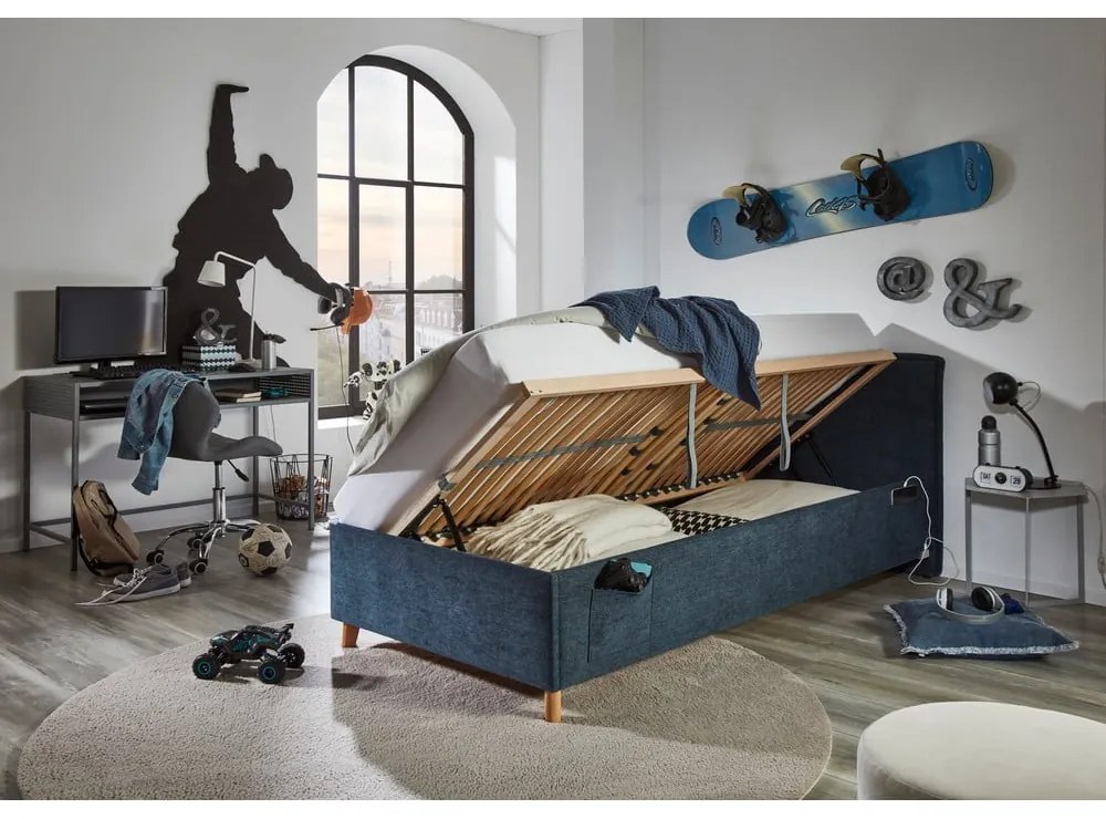 Тъмносиньо тапицирано детско легло 90x200 cm с място за съхранение с включена подматрачна рамка Fun – Meise Möbel