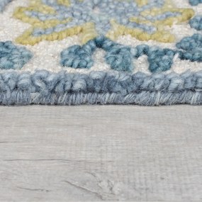 Ръчно изработен килим със смес от вълна в синьо и цвят слонова кост 120x170 cm Myla Floral Frame – Flair Rugs