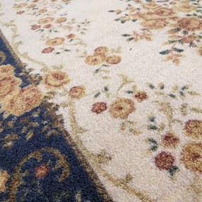 Качествен кремаво-син килим с цветен мотив Ширина: 120 см | Дължина: 170 см